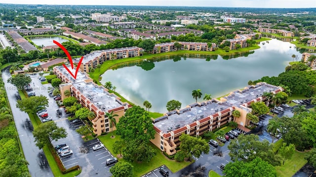 6219 Coral Lake Dr Unit 207, Margate, FL 33063 - birds eye view of property featuring a water view