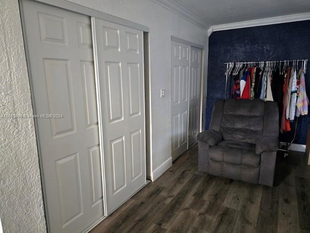 sitting room with ornamental molding and wood-type flooring