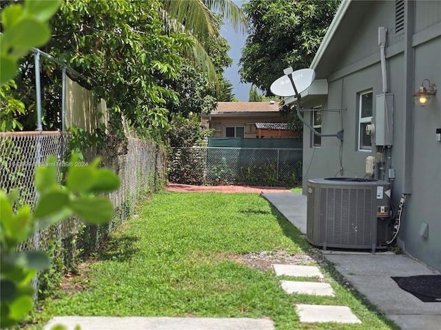 view of yard featuring central air condition unit