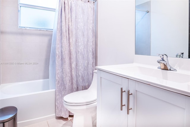 bathroom featuring shower / bath combo with shower curtain, vanity, toilet, and tile patterned flooring