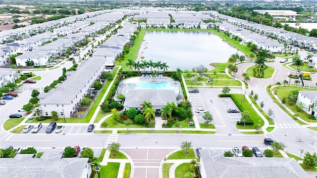 aerial view featuring a water view and a residential view