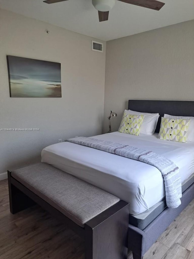 bedroom featuring ceiling fan and hardwood / wood-style flooring