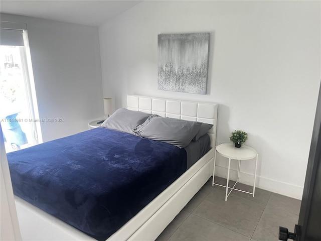 bedroom with tile patterned floors