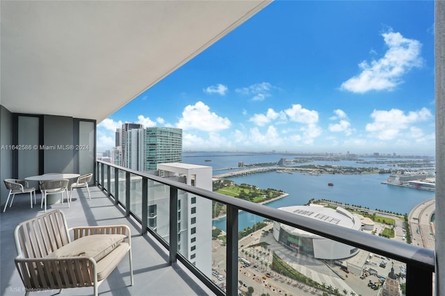 balcony featuring a water view