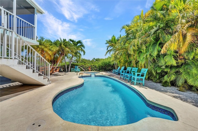 view of swimming pool featuring a patio area