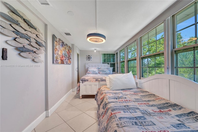 bedroom with light tile patterned flooring