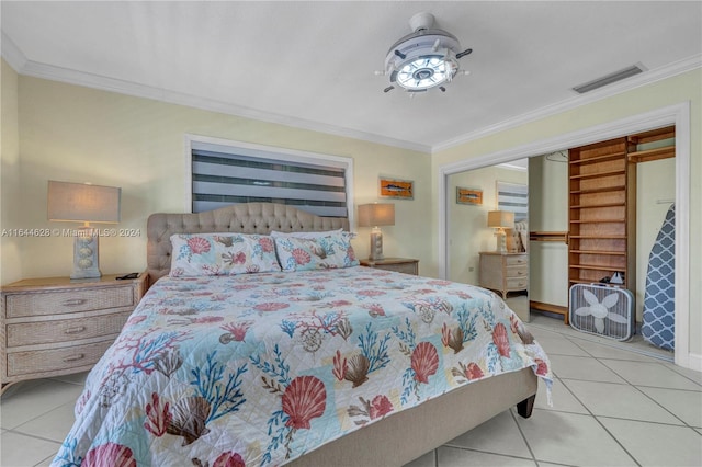 bedroom with crown molding and light tile patterned floors