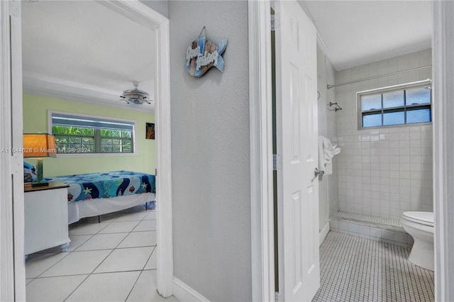 bathroom featuring toilet and tile patterned floors