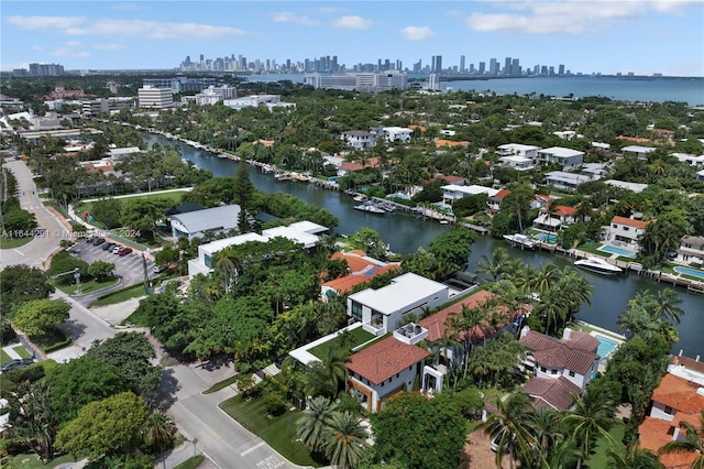 aerial view featuring a view of city and a water view