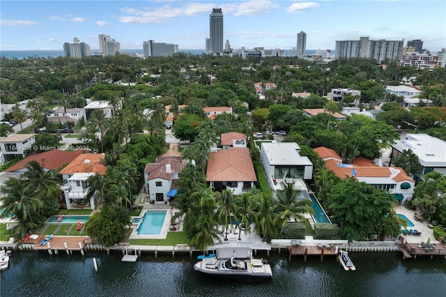 bird's eye view featuring a water view and a view of city