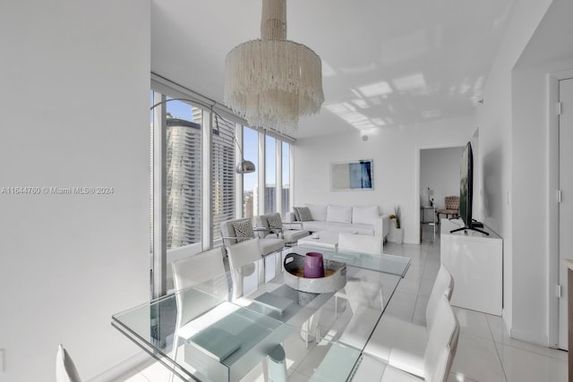 tiled dining area featuring an inviting chandelier