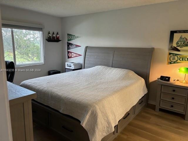 bedroom with light hardwood / wood-style flooring