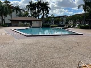 view of swimming pool with a patio area