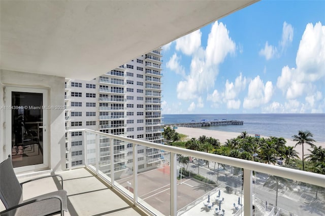 balcony with a view of the beach and a water view