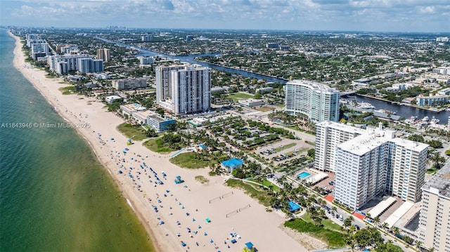 view of property featuring a beach view and a water view