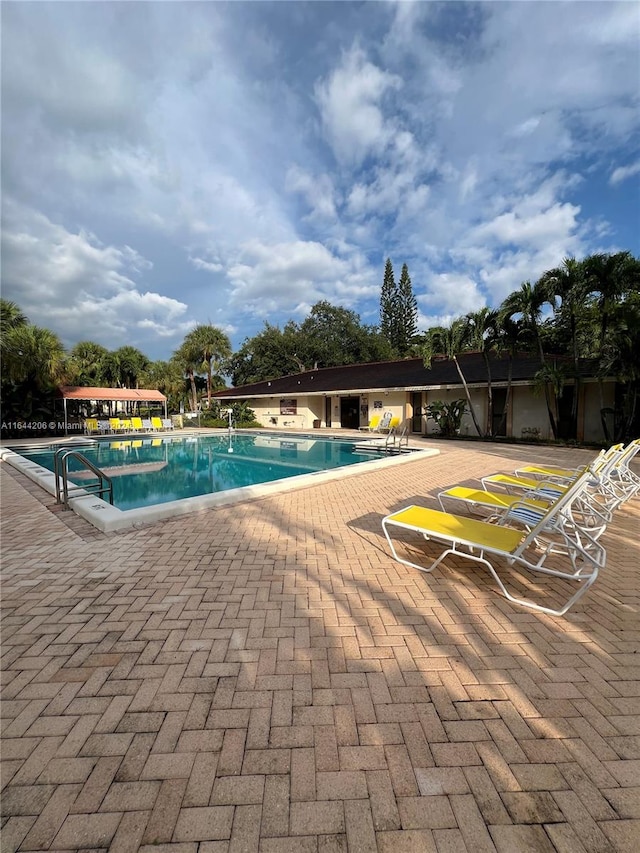 view of swimming pool featuring a patio