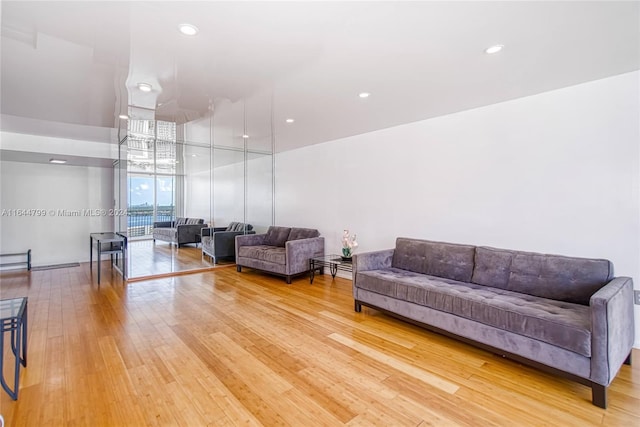 living room with light wood-type flooring and expansive windows