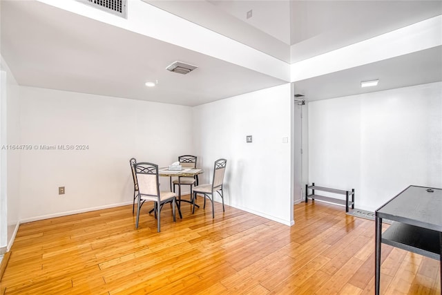 dining space featuring hardwood / wood-style flooring