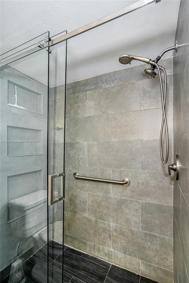 bathroom with an enclosed shower