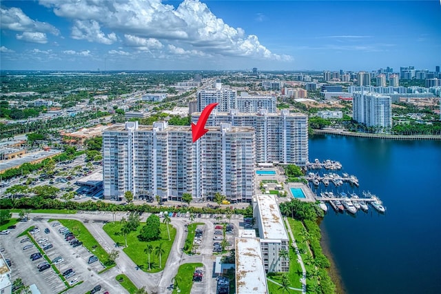 birds eye view of property with a water view