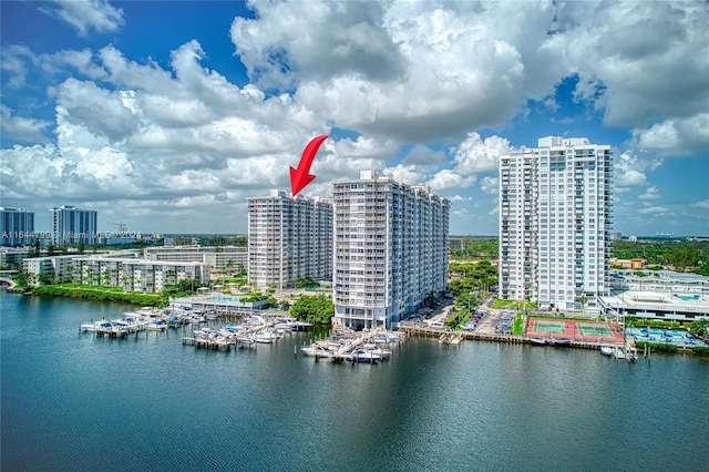 birds eye view of property with a water view