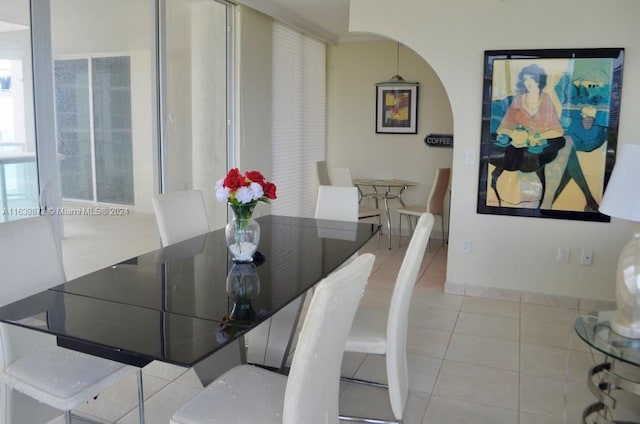 dining area featuring light tile patterned floors