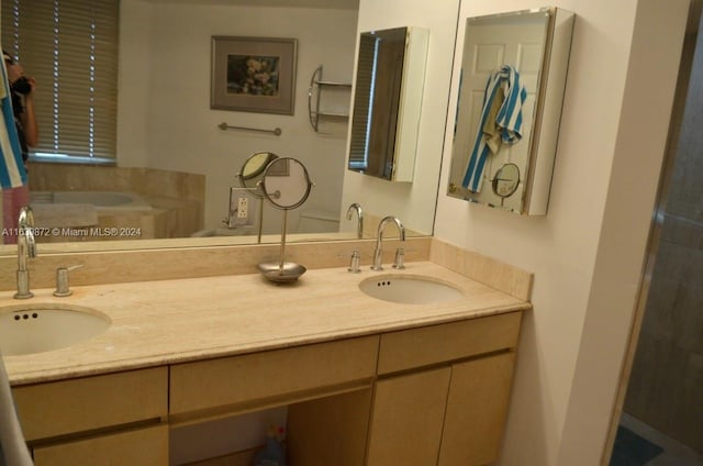 bathroom with a tub to relax in and vanity