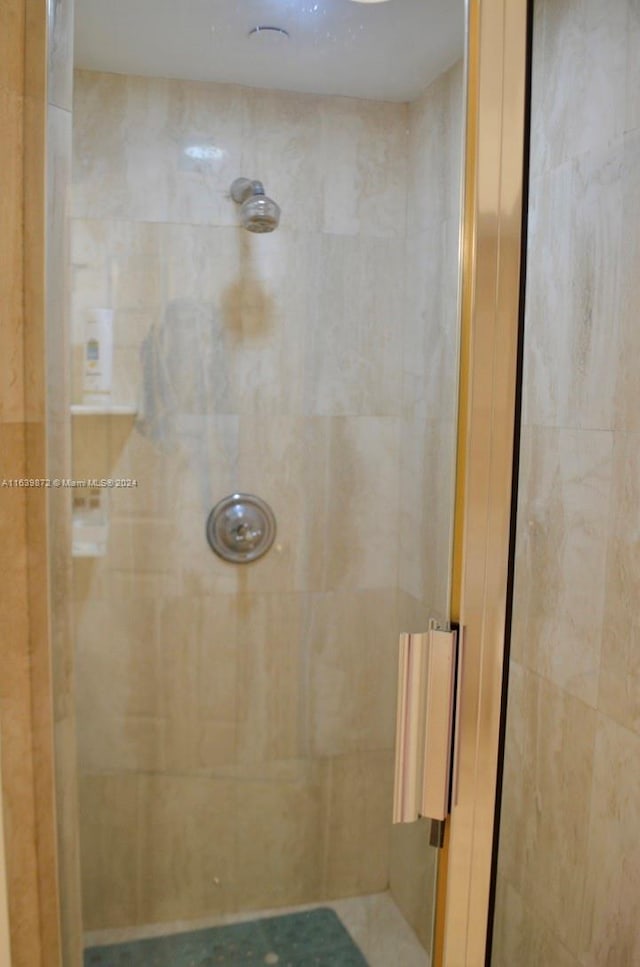 bathroom with a tile shower