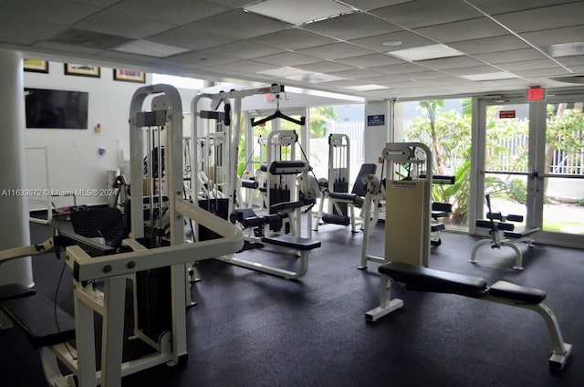 gym featuring a drop ceiling