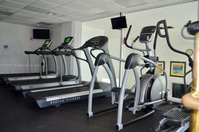 workout area featuring a paneled ceiling