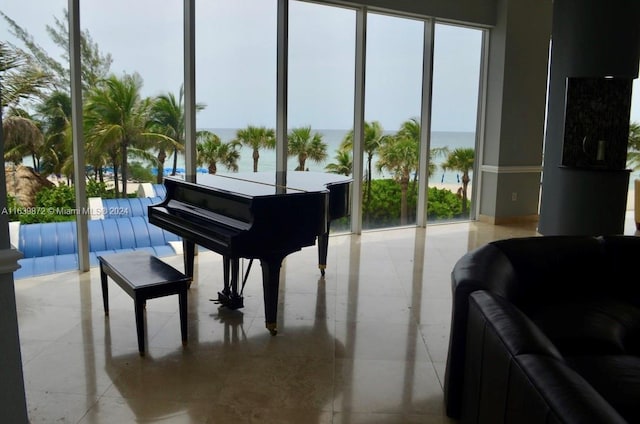 miscellaneous room featuring a water view and light tile patterned floors