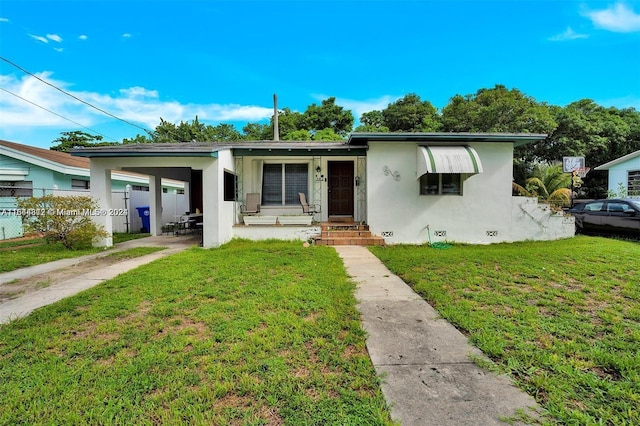 bungalow-style house featuring a front yard