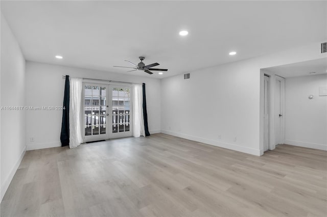 unfurnished room featuring light hardwood / wood-style flooring, ceiling fan, and french doors