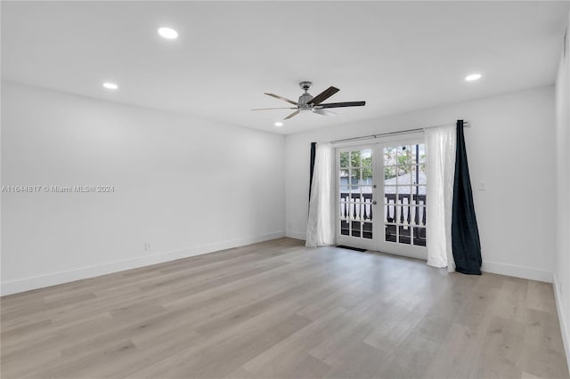 empty room featuring ceiling fan, light hardwood / wood-style flooring, and french doors