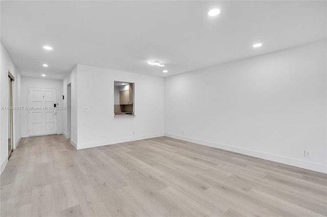 spare room with light hardwood / wood-style floors