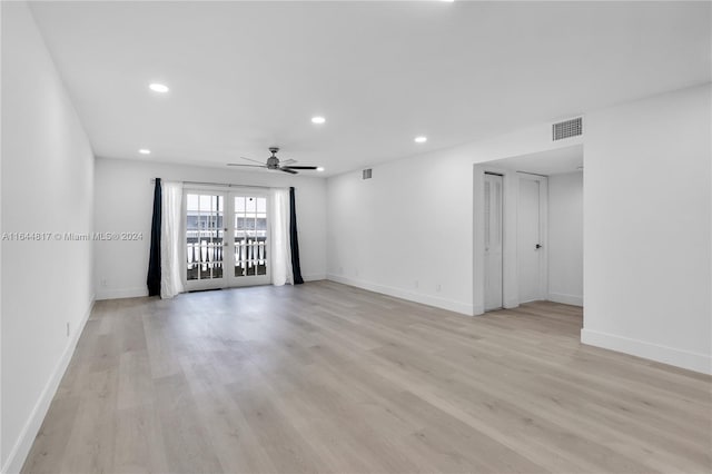 spare room with ceiling fan, light hardwood / wood-style flooring, and french doors