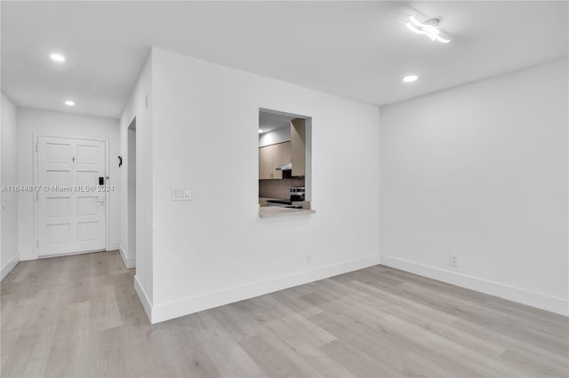 spare room featuring light hardwood / wood-style floors