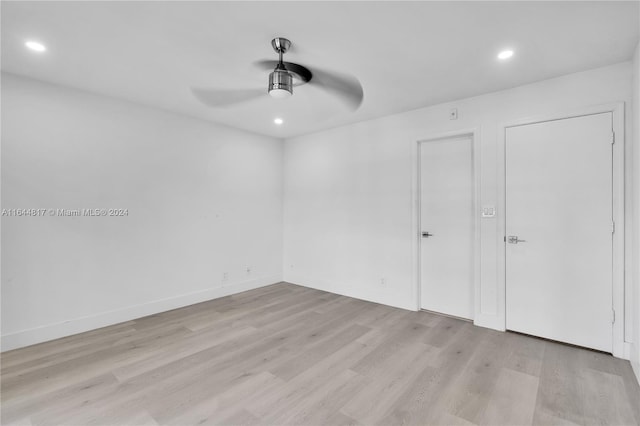 unfurnished bedroom with light hardwood / wood-style floors and ceiling fan