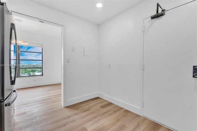 unfurnished room featuring light wood-type flooring