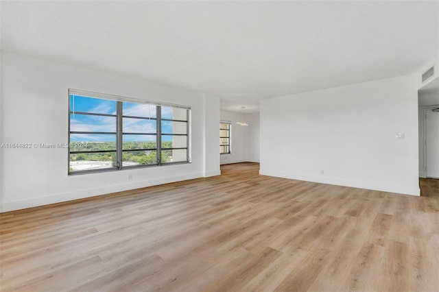 unfurnished living room with light hardwood / wood-style floors