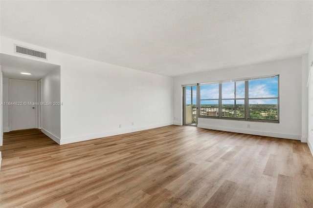 unfurnished room featuring light wood-type flooring