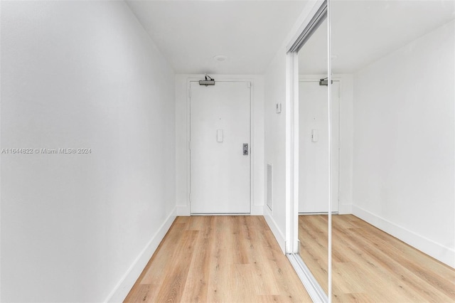 hallway featuring light hardwood / wood-style flooring