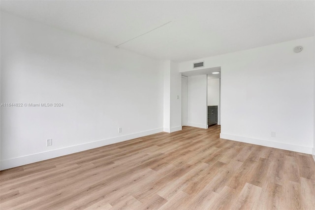 spare room featuring light hardwood / wood-style floors