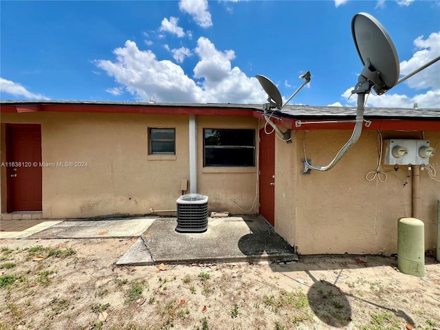 back of property with central AC unit