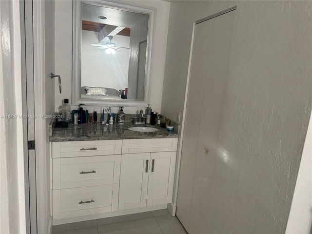 bathroom featuring ceiling fan, tile patterned floors, and vanity