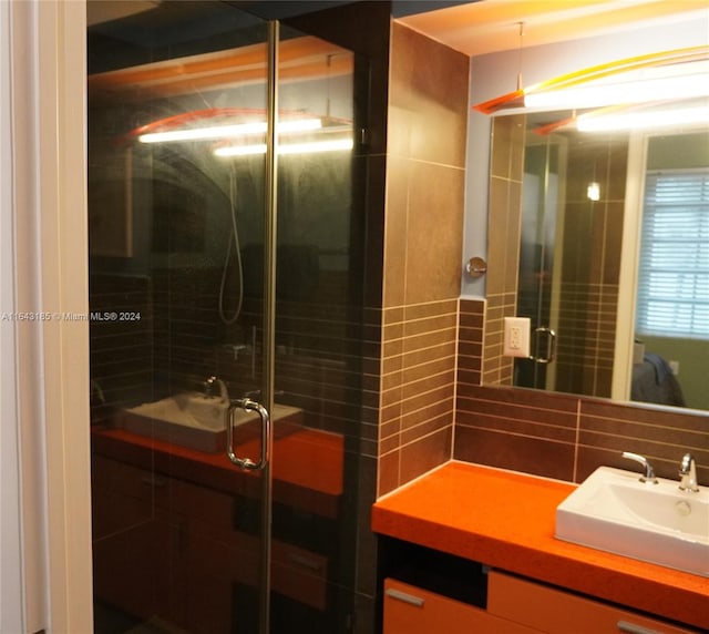 bathroom featuring decorative backsplash and vanity