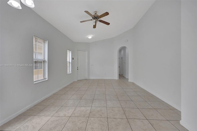 tiled empty room with ceiling fan