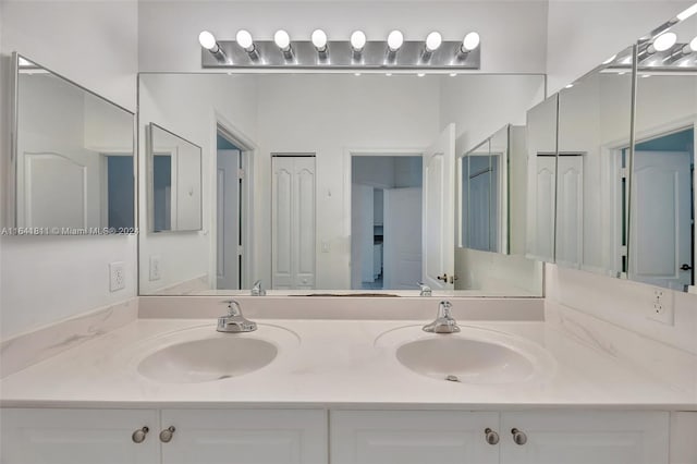 bathroom featuring double vanity