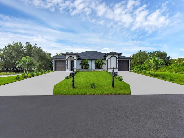 ranch-style home featuring a front yard and a garage