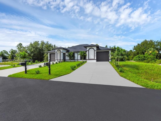 view of front facade with a front lawn and a garage